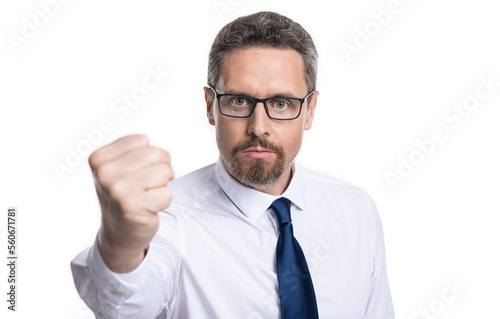 photo of caucasian man threatening with fist in eyewear. man threatening with fist