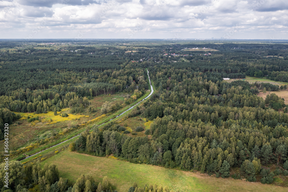 Aerial drone view from Czarny Las village with Czarna river near Gora Kalwaria city, Poland