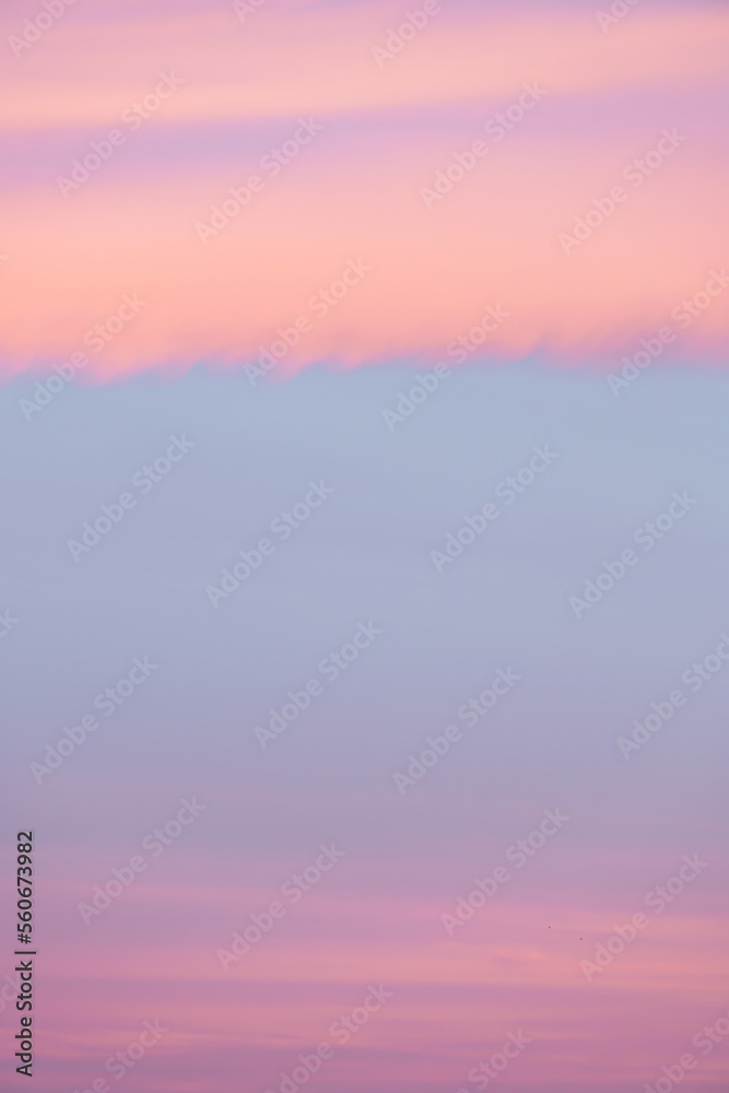Stunning sunset with beautiful shades of orange, pink, purple and blue colors. Wallpaper, natural background with copy space.