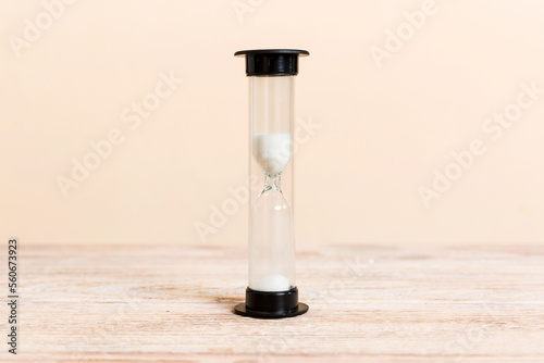 hourglass on the table, sand clock as time passing concept for business deadline, copy space
