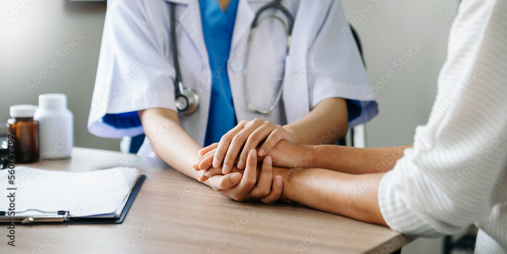 The doctor holds the patient’s. hand Healthcare and medical concept. In hospital. The doctor holds the patient’s. hand Healthcare and medical concept. In hospital.