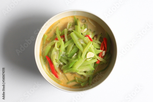 Sayur Labu Siam or  Sayur Manisa or Jipang or Chayote vegetable ,Indonesian food, made from slice of chayote cooked with spicy coconut milk, isolated on white background, top view.