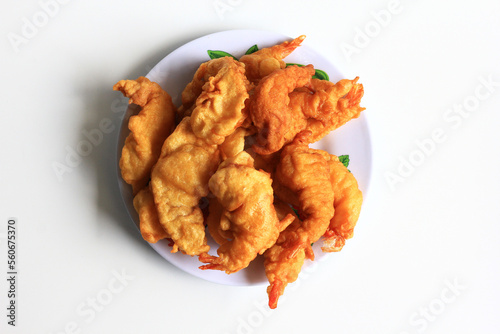 Udang Goreng Tepung or Tempura. Floured fried shrimp, simple traditional Indonesian food and often made at home, isolated on white background.
