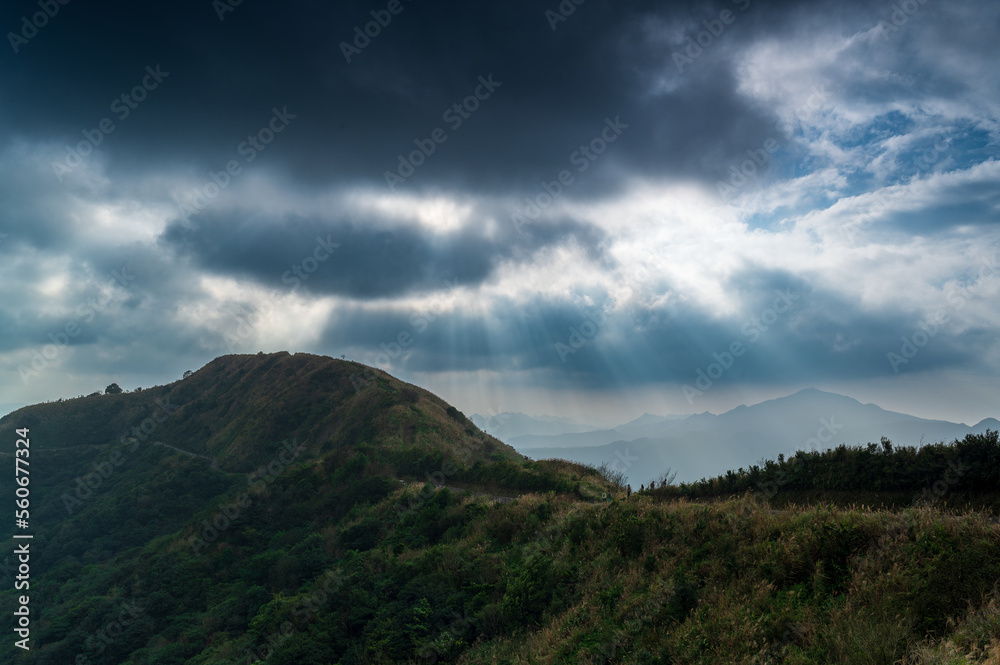 Watch the romantic Crepuscular Ray (cloud gap light) on the mountain. Buyan Pavilion, Shuangxi District, New Taipei City. Taiwan