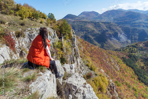 Traveler Woman sitting  on a rocks  in the autumn  mountain with scenery view . Balkan mountains,  ,Bulgaria © boryanam