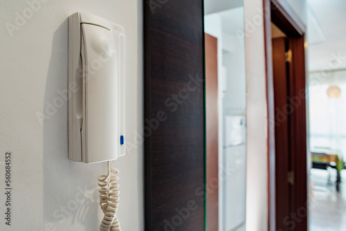 Intercom in the apartment on a white wall close-up