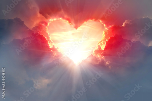  Red heart shaped clouds at sunset. Beautiful love background with copy space.Valentine's Day concept.
