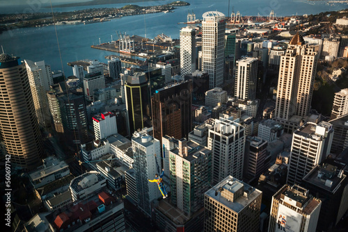 Man jumping over Downtown from the Sky Tower Observatory Auckland, New Zealand