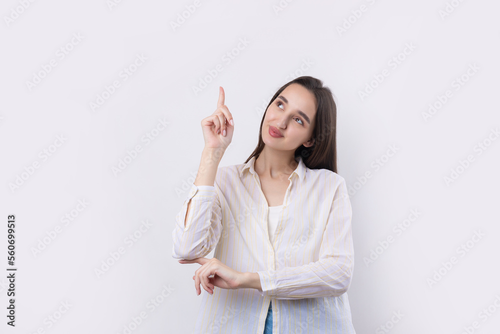 Happy young caucasian female in a shirt pointing fingers away Happy young caucasian female in a shirt pointing fingers away