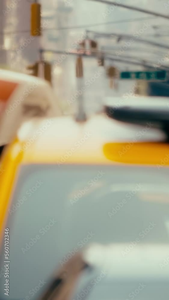 Manhattan street, yellow taxi cars, rush hour, hot summer day, vertical short video