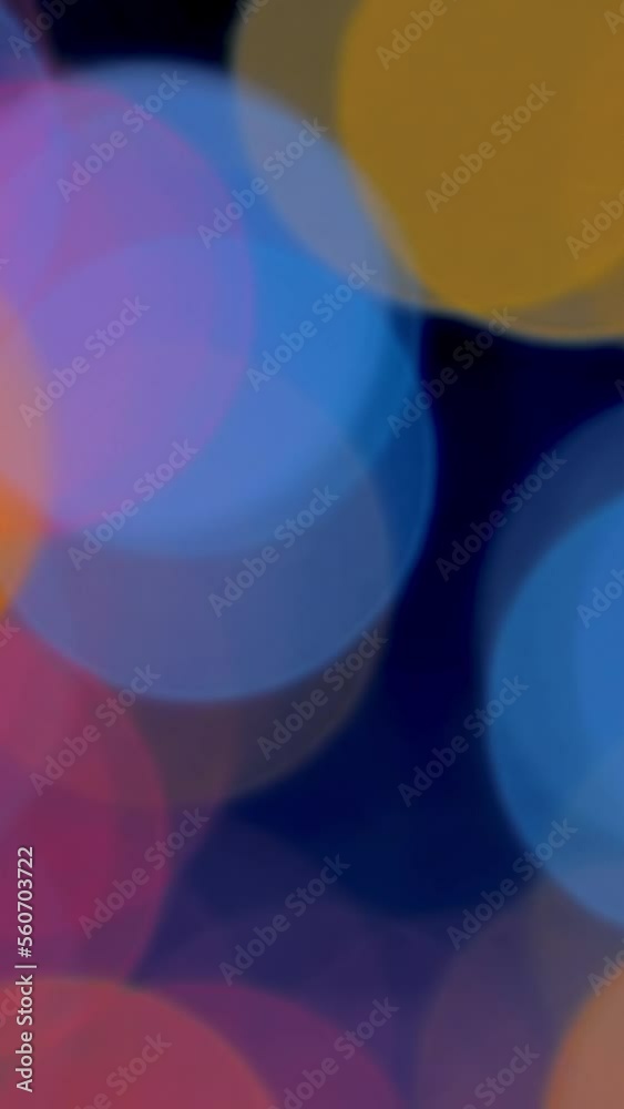 Abstract motion vertical background with colourful defocused circles, festive image, smartphone wallpaper Abstract motion vertical background with colourful defocused circles, festive image, smartphone wallpaper