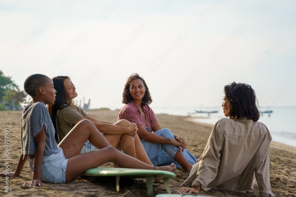 © Jovo Jovanovic/Stocksy - Happy friends relaxing together during beach holiday in summer