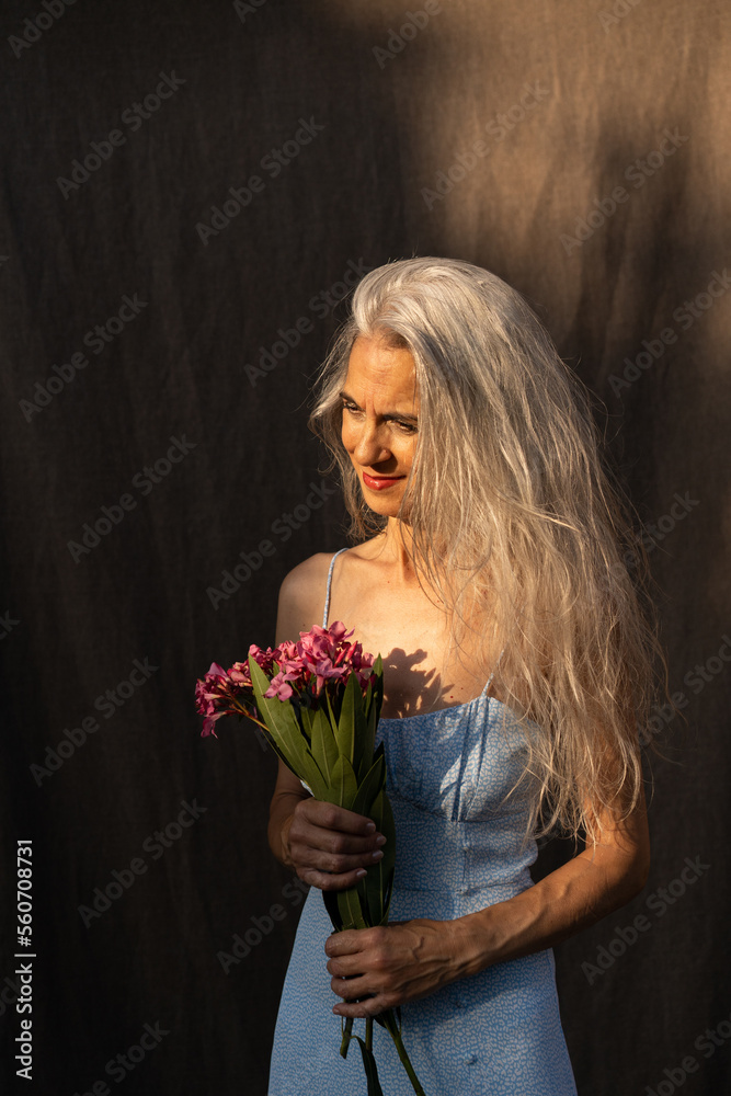 Senior woman with bouquet of flowers