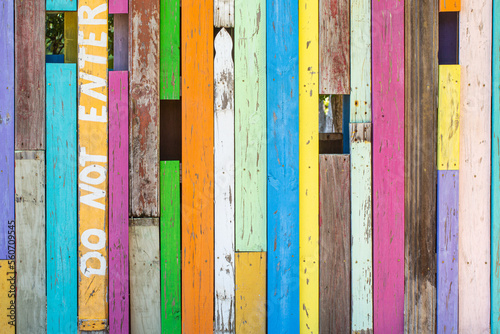 Colorful wooden wall with Do Not Enter painted on it photo