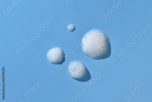 Soap foam bubble isolated on blue background object beatuy health