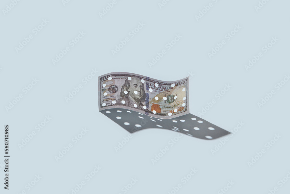 One hundred dollar bill with holes. One hundred dollar bill with holes.