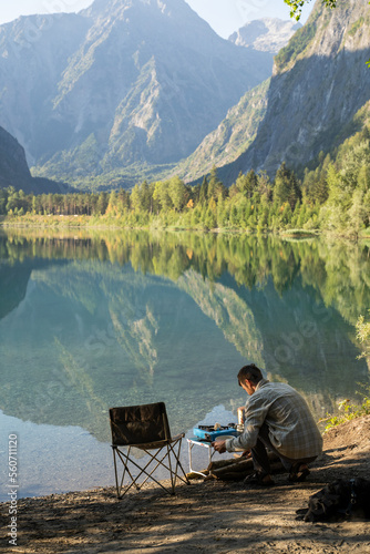 Man making coffee in nature photo