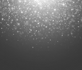 Silver glitter light effect. Glowing background of sparkles particles. Blurred bokeh twinkle on transparent background.