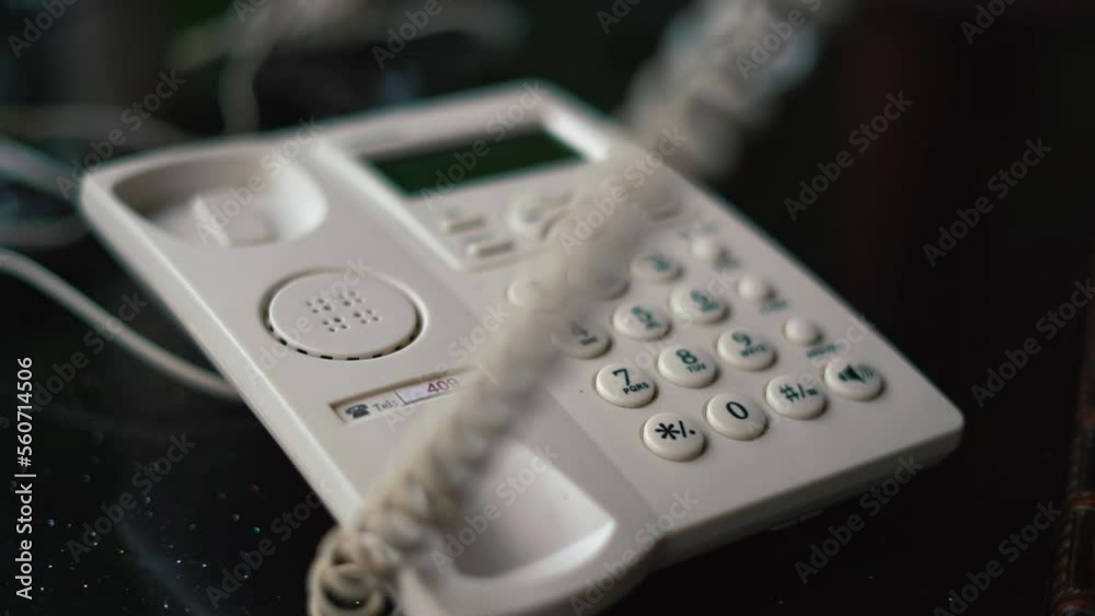 Worker Man hand office worker picking up the phone to answer a phone call whilst working at his desk. pick up the phone and answer the call. retro telephone. High quality 4k footage Worker Man hand office worker picking up the phone to answer a phone call whilst working at his desk. pick up the phone and answer the call. retro telephone. High quality 4k footage