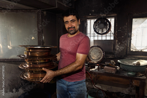man making dishes photo