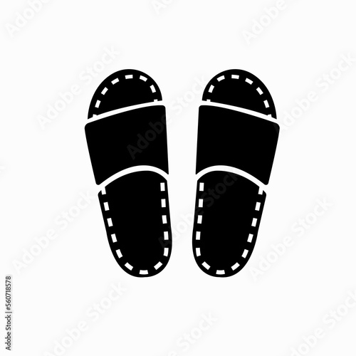 Beach shoe icon. Black rubber flip-flops. Summer fashion shoes with holes and a strap. Hot summer. Vacation. Vector image isolated on a white background. Flat icon in black style.