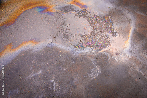 Beautiful abstract colorful background, engine oil stains on asphalt © AleksFil