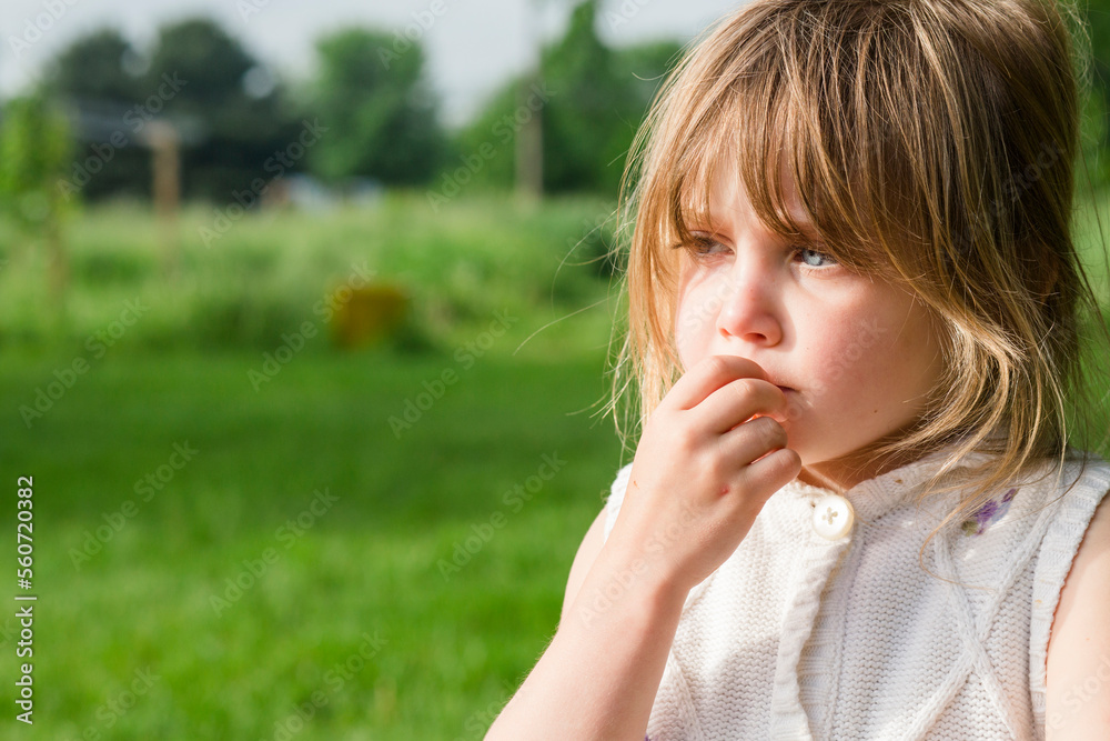 Close-up of cute thoughtful girl looking away at farm Close-up of cute thoughtful girl looking away at farm
