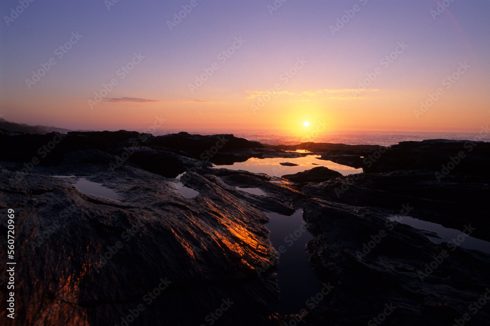 Sunrise over the Atlantic Ocean reflects in tidal pools at Two Lights State Park near Portland, ME Sunrise over the Atlantic Ocean reflects in tidal pools at Two Lights State Park near Portland, ME