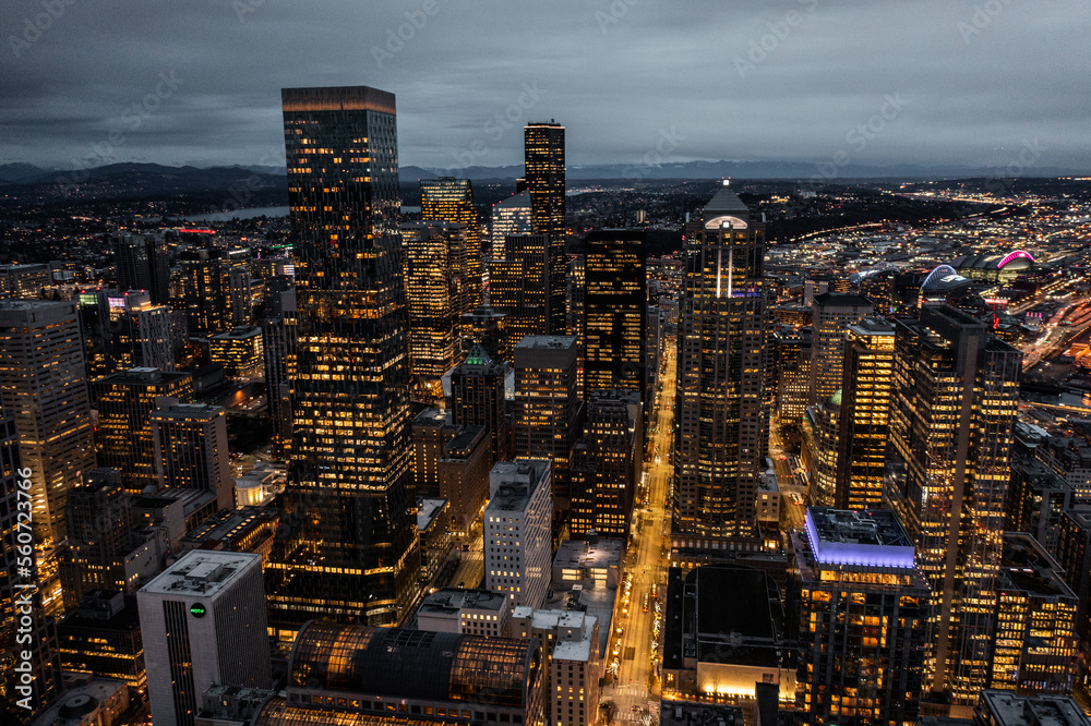 Obraz premium Seattle, Washington, USA - Jan.2023, night aerial view of illuminated Seattle Downtown with skyscrapers, traffic on streets - aerial night view