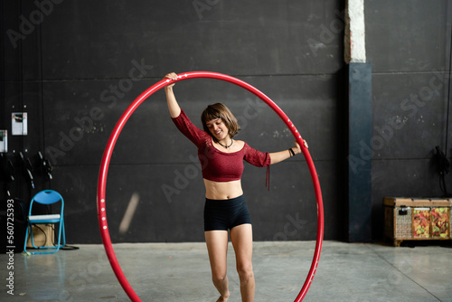 Artist balancing with the hoop photo