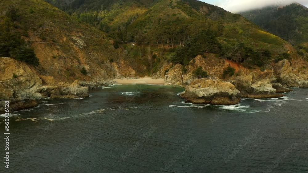 Aerial Scenic View Of Forest On Mountains Under Clouds, Drone Flying Backwards Over Ocean At Beach - San Francisco, California Aerial Scenic View Of Forest On Mountains Under Clouds, Drone Flying Backwards Over Ocean At Beach - San Francisco, California