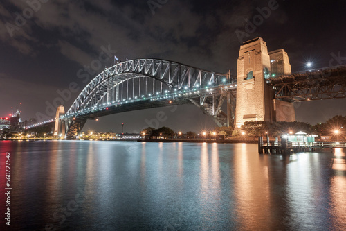 Sydney Harbour Bridge at Night. Long Exposure. Flowing Sky and Reflection on Water. Australia