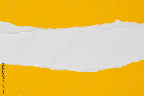 Yellow paper with torn edges on white paper background inside