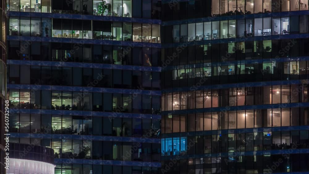 Close up view to glowing office windows in Skyscrapers International Business Center of City at night timelapse from top Close up view to glowing office windows in Skyscrapers International Business Center of City at night timelapse from top