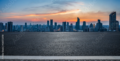 Fototapeta Naklejka Na Ścianę i Meble -  Asphalt road and city skyline with modern buildings at sunset in Shanghai, China.