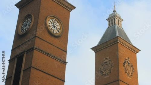 Ancient Clock Tower At The Entrance Of Liverpool Street Station In London, United Kingdom. Low Angle Shot photo