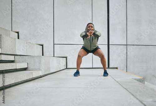 Fitness  exercise or man stretching body in training  exercise or workout with focus  resilience or commitment. Warm up  mindset or healthy sports athlete with goals or motivation on city stairs