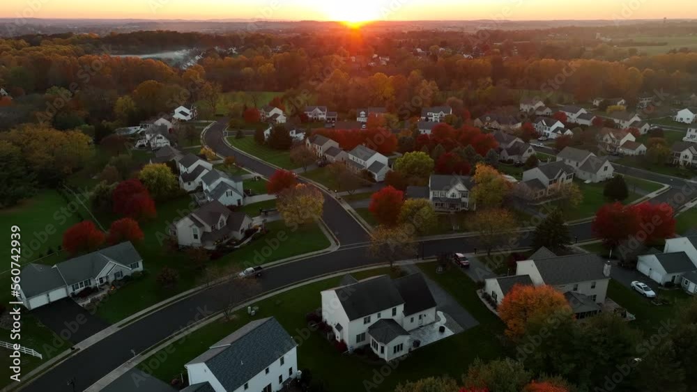 Modern homes in new housing development in USA in autumn sunset. Aerial view. Modern homes in new housing development in USA in autumn sunset. Aerial view.