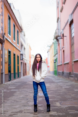 Beauty transgender woman in colorful wall looking at camera