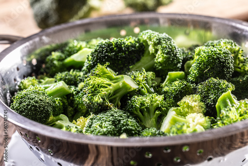 Steamed broccoli in a stainless steel steamer - Close up. Healthy vegetable concept