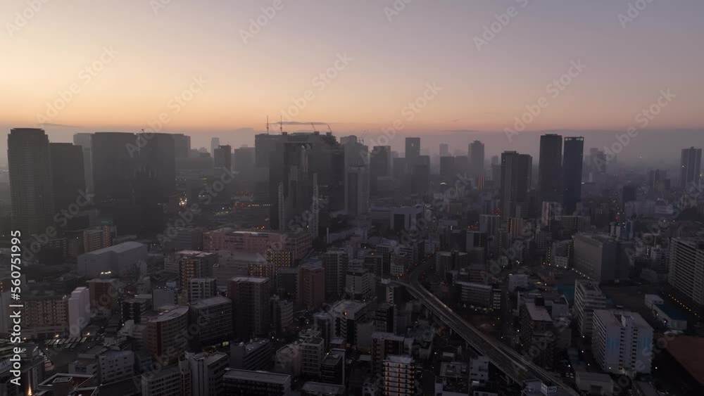 Hazy Sunrise Over Modern High Rise Buildings in City Center from Air Hazy Sunrise Over Modern High Rise Buildings in City Center from Air