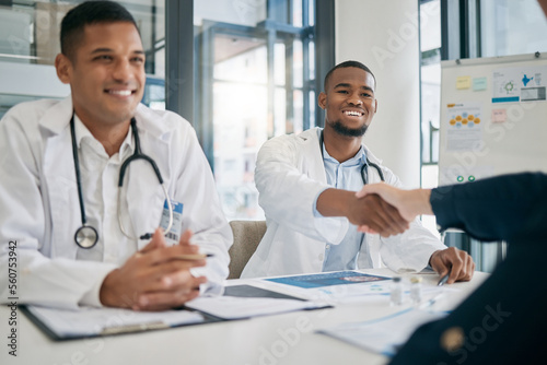 Doctor  handshake and meeting with patient  smile and greeting for vaccination education  talk or help. Black man  doctors and shaking hands with client for wellness  healthcare or medicine in clinic