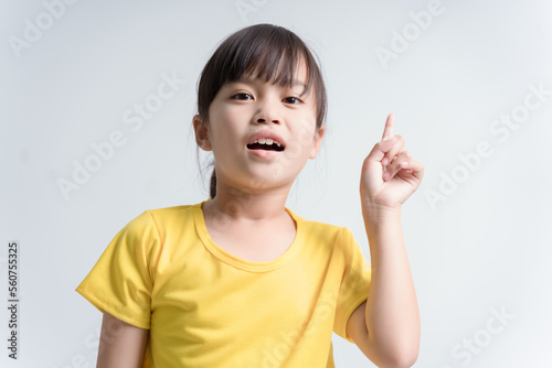 Close-up portrait of her she nice attractive lovely glad cheerful cheery girl pointing forefinger up isolated white color background