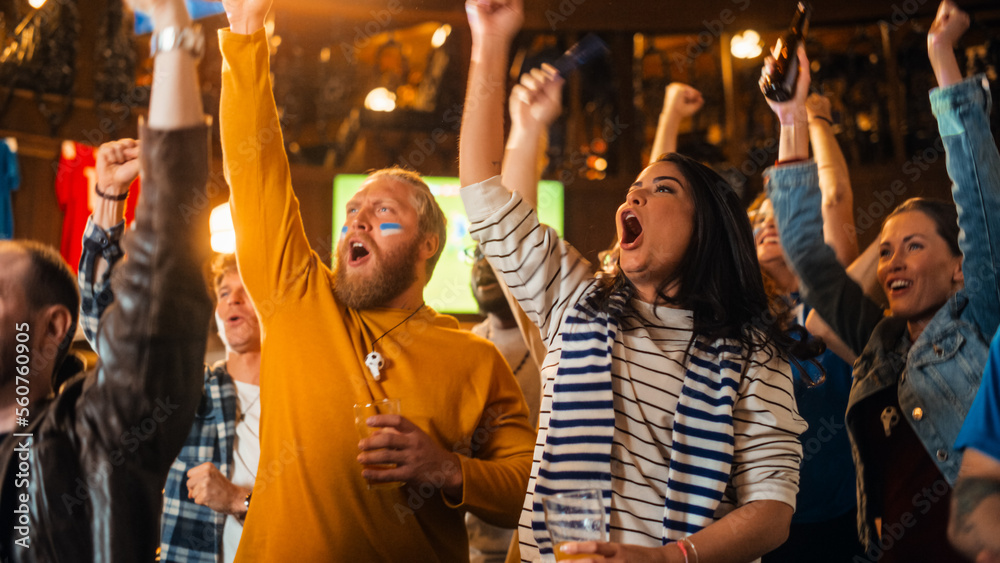 Group of Soccer Fans with Colored Faces Watching a Live Football Match in a Sports Bar. People Cheering for Their Team. Player Scores a Goal and Crowd Celebrate Winning the Championship.