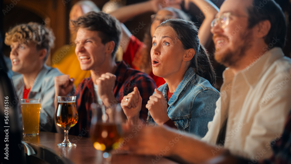 Excited Beautiful Female Sitting at a Bar Stand with Group of Friends, Cheering for a Soccer Team Playing in Tournament. Supportive Fans Applauding, Raising and Shouting in a Sports Pub. Excited Beautiful Female Sitting at a Bar Stand with Group of Friends, Cheering for a Soccer Team Playing in Tournament. Supportive Fans Applauding, Raising and Shouting in a Sports Pub.