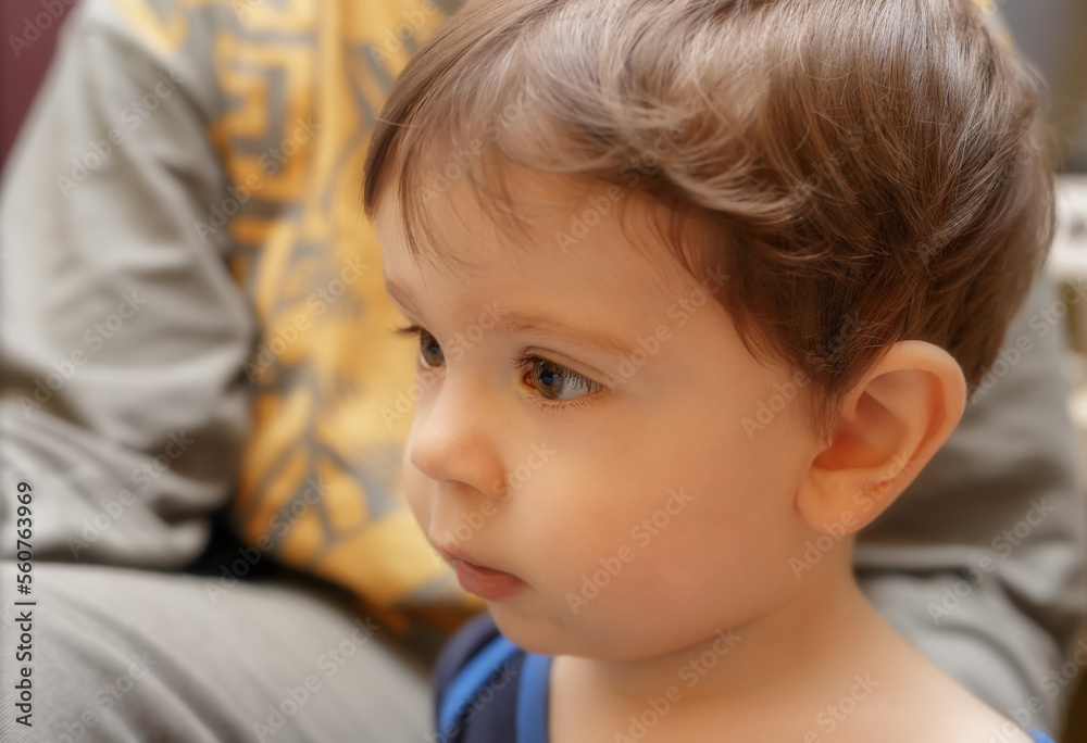 Portrait of a little caucasian boy looking into the distance Portrait of a little caucasian boy looking into the distance