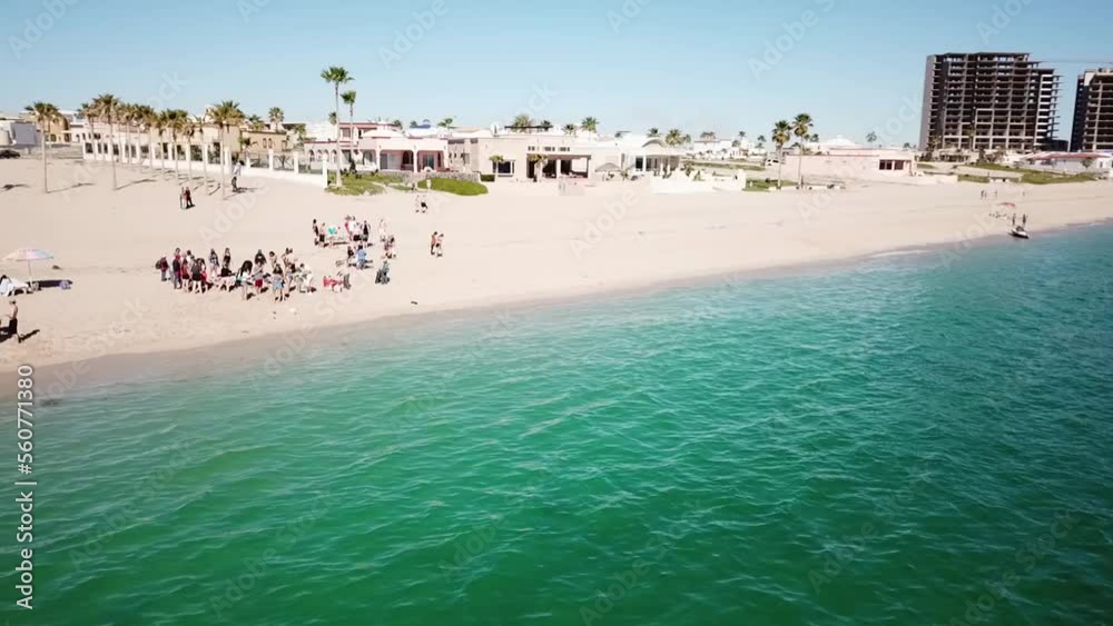 Drone shot of a group of college students on a Mexican beach during Spring Break. Drone shot of a group of college students on a Mexican beach during Spring Break.