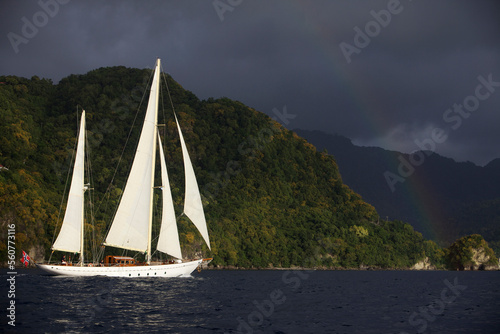 A classic yacht sails along the coast of St. Lucia with the Pitons in the background. photo