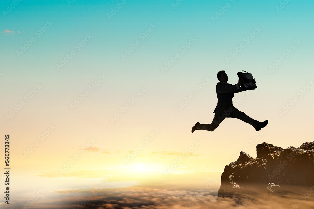 Businessman jump through the gap