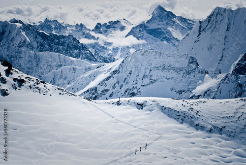 A group of skiers climb toward the Col du Sonadon while touring the classic Haute Route in Switzerland. photo